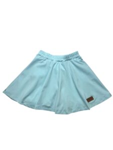 a blue skirt with a brown patch on the side