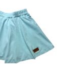 a light blue shorts with a brown patch on the side